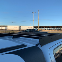Close up rear view of Economy Roof Rack on a white Toyota Tacoma - Cali Raised LED