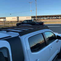 Rear view of Economy Roof Rack on a white Toyota Tacoma - Cali Raised LED