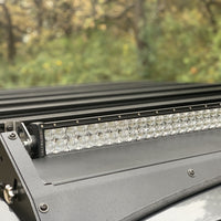 Close up view of gray Toyota Tacoma with Premium Roof Rack with exposed light bar- Cali Raised LED