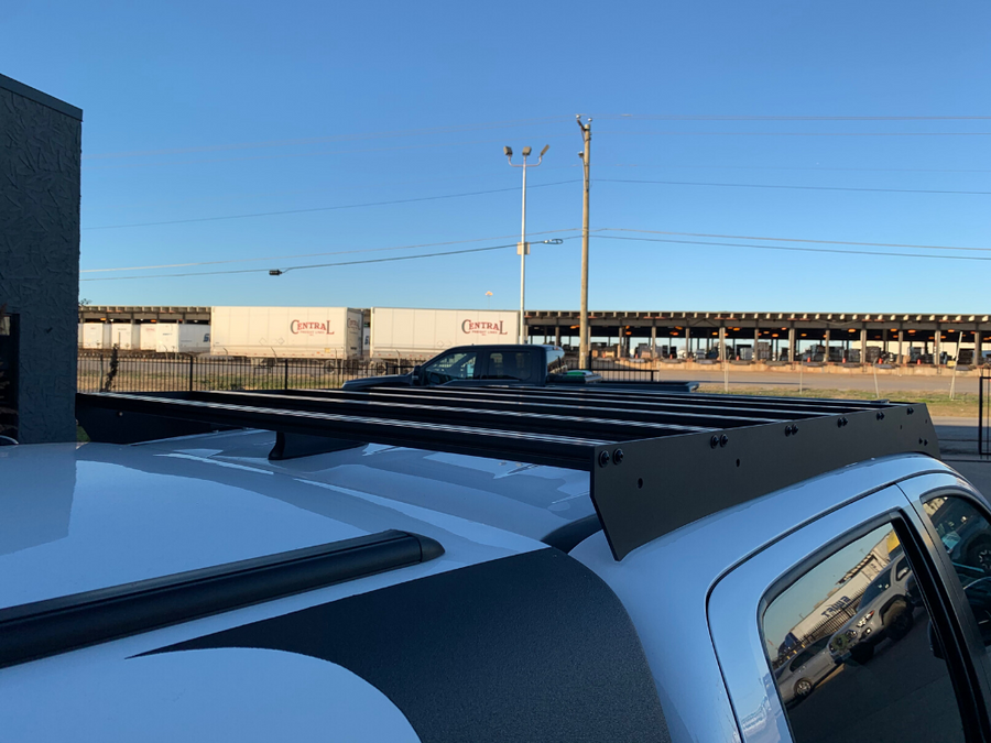 Close up rear view of Economy Roof Rack on a white Toyota Tacoma - Cali Raised LED