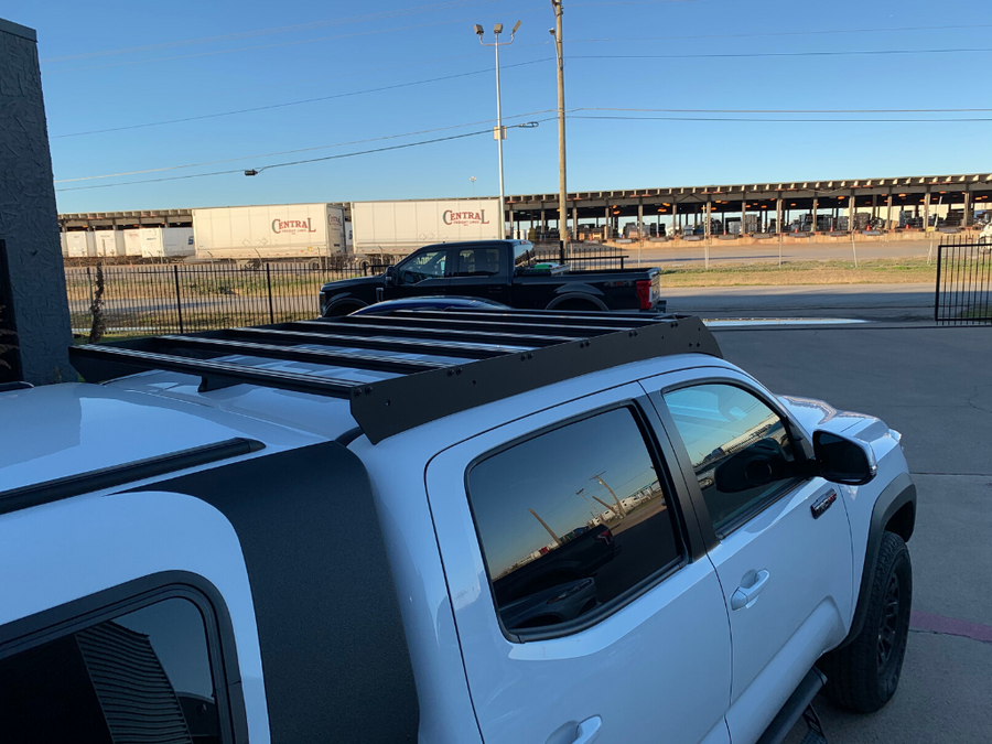 Rear view of Economy Roof Rack on a white Toyota Tacoma - Cali Raised LED