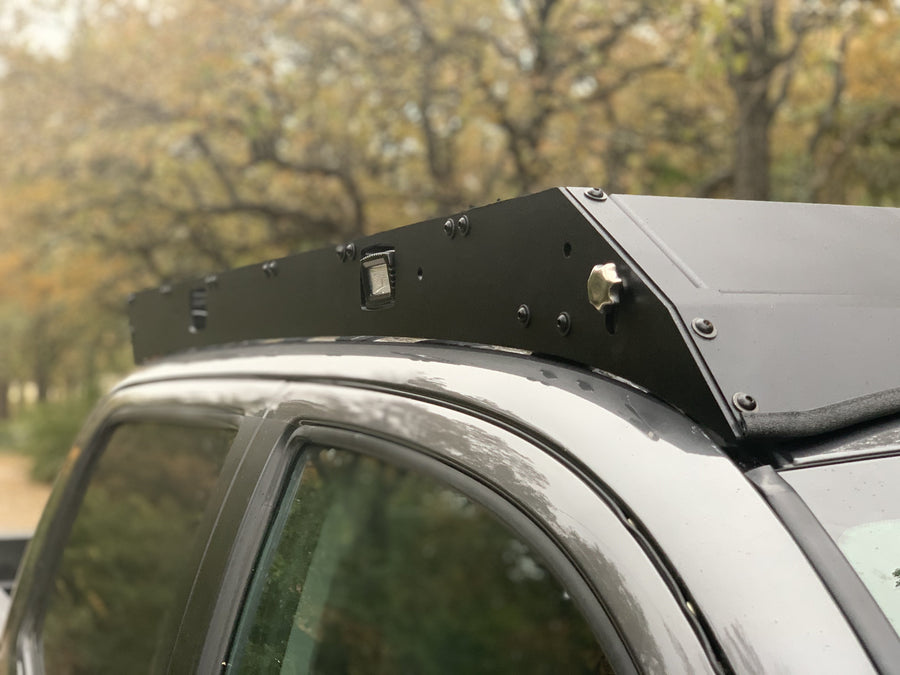 Close up view of gray Toyota Tacoma with Premium Roof Rack with covered light bar - Cali Raised LED