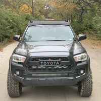 Front view of gray Toyota Tacoma with Premium roof rack with covered light bar - Cali Raised LED